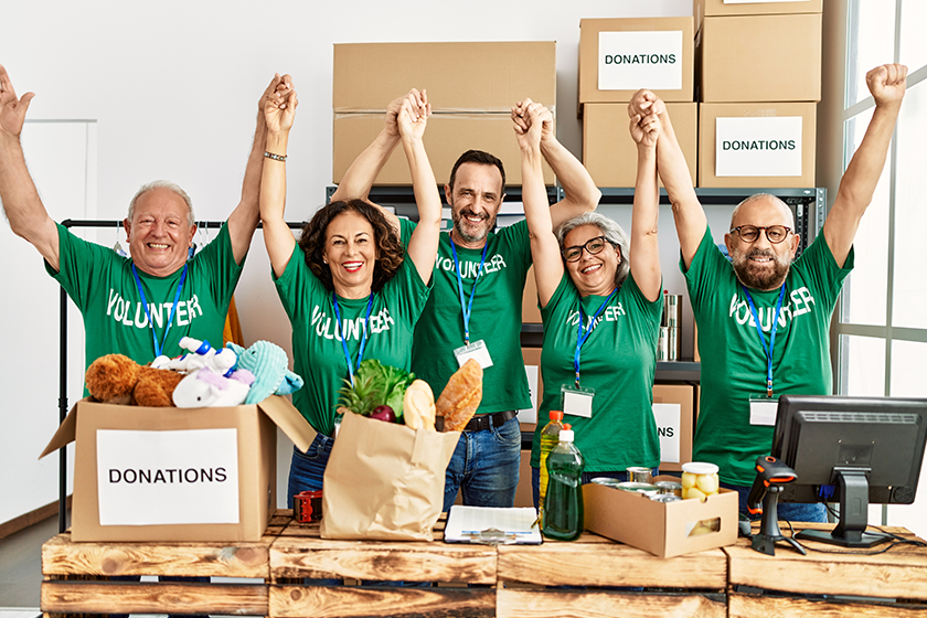 Group of middle age volunteers smiling