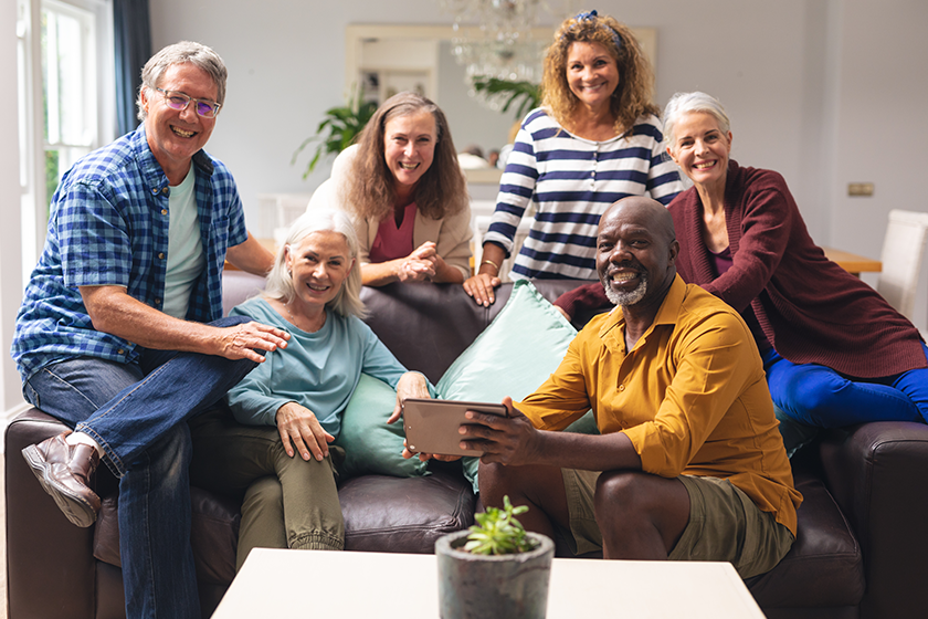 Portrait of smiling multiracial senior male and female friends 